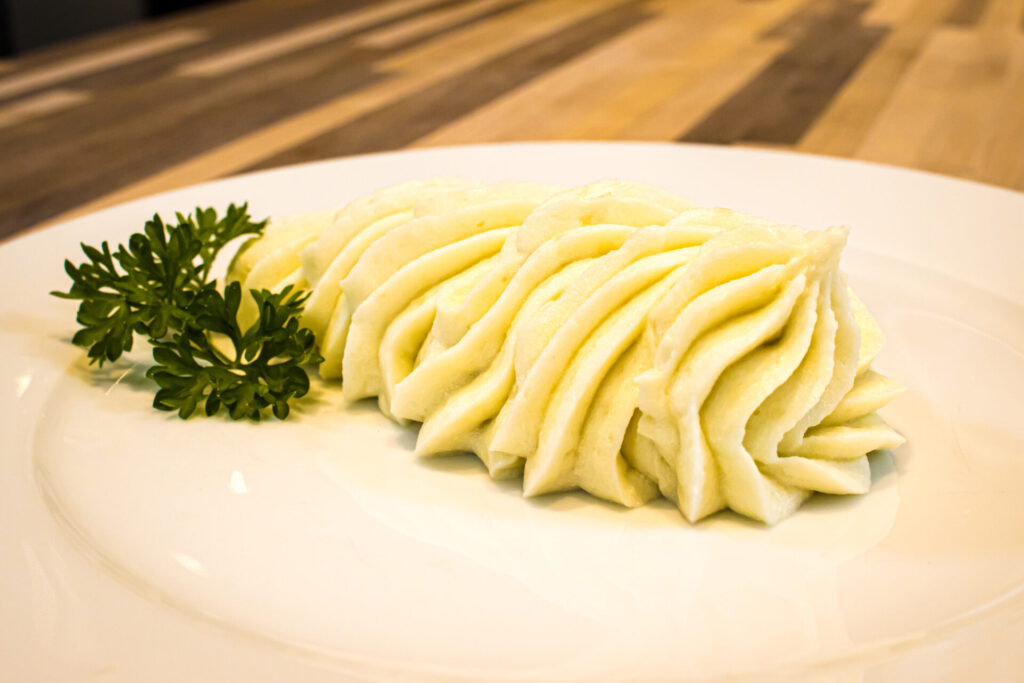 Creamy Mashed Potatoes on the plate, medium distance shot.