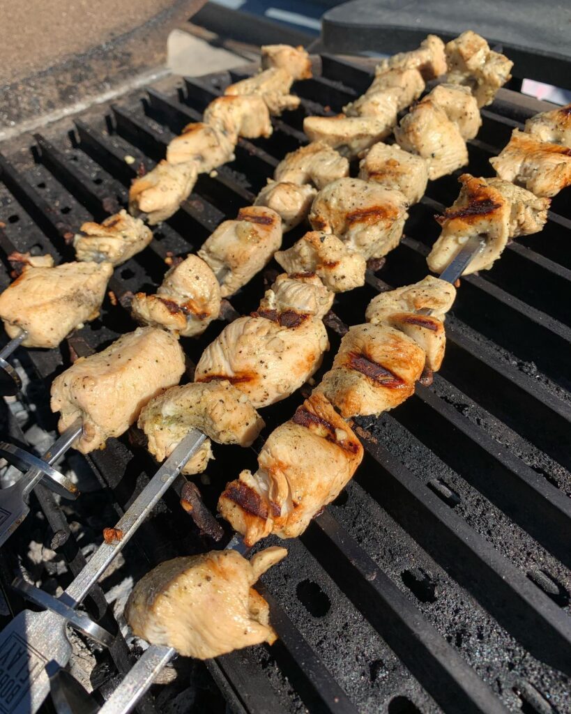 Grilled Pork Kabob with Tzatziki by Bill Losh are bieing prepared on the grill, close up top shot