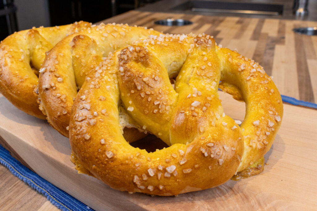 Example of Speciality Bread: Czech Soft Pretzels on the wooden cutting board