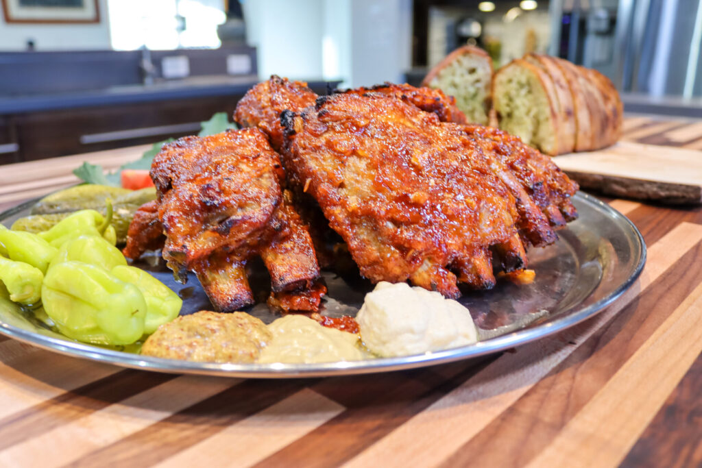 BBQ - Honey Pork Ribs in side close up shot with the kitchen in the background