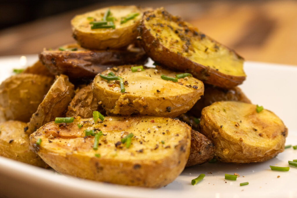Detail shot of Easy Roasted Fingerling Potatoes on the oval plate