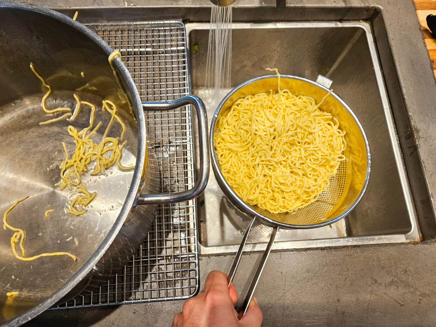 Spaghetti are being drained