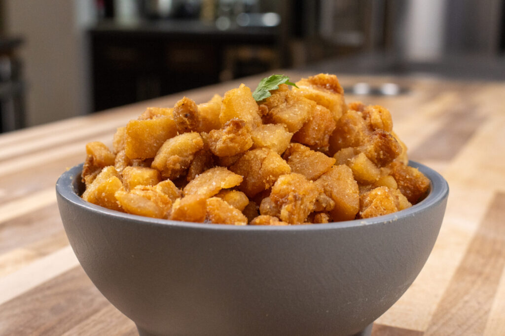 Pork Cracklings (Škvarky) side shot with the kitchen in the background