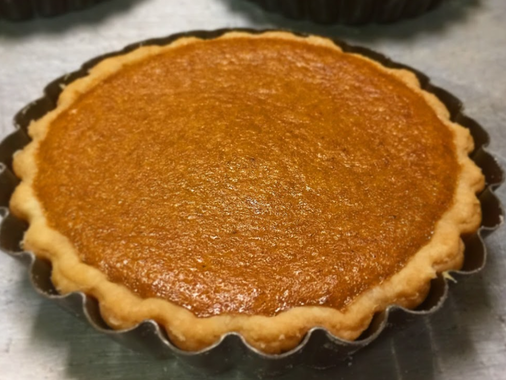 Sweet Potato Pie in the pie pan, on the gray surface