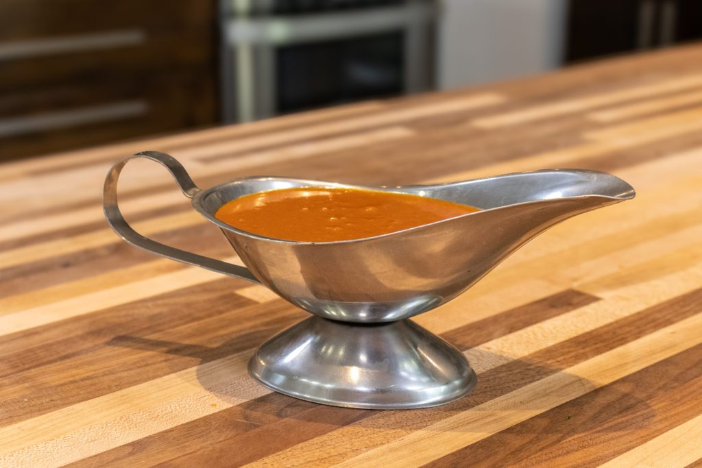 Close up side shot of Buffalo Sauce in the sauce