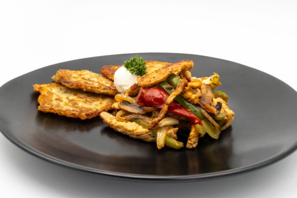 Slovak Meat Sauté Mäsové Soté on the black plate in detail side shot