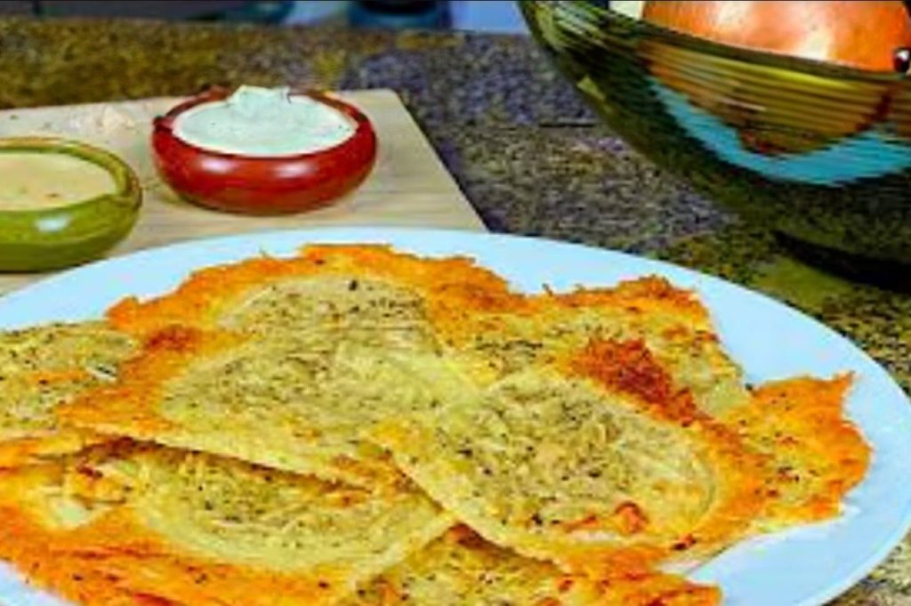 Crispy Parmesan Ranch Onion Chips in detail on the white plate on the kitchen table