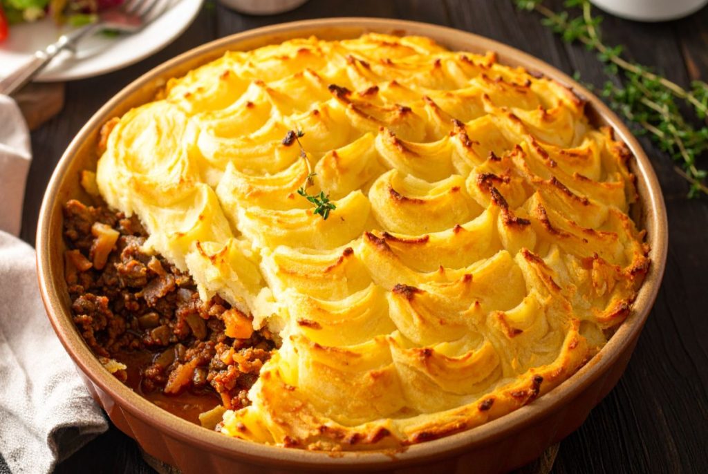 Classic Shepherd's Pie in the baking dish, close up side shot