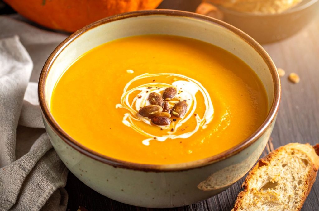 Easy 15-Minute Pumpkin Soup in the rustic bowl, on the rustic table, top close up shot