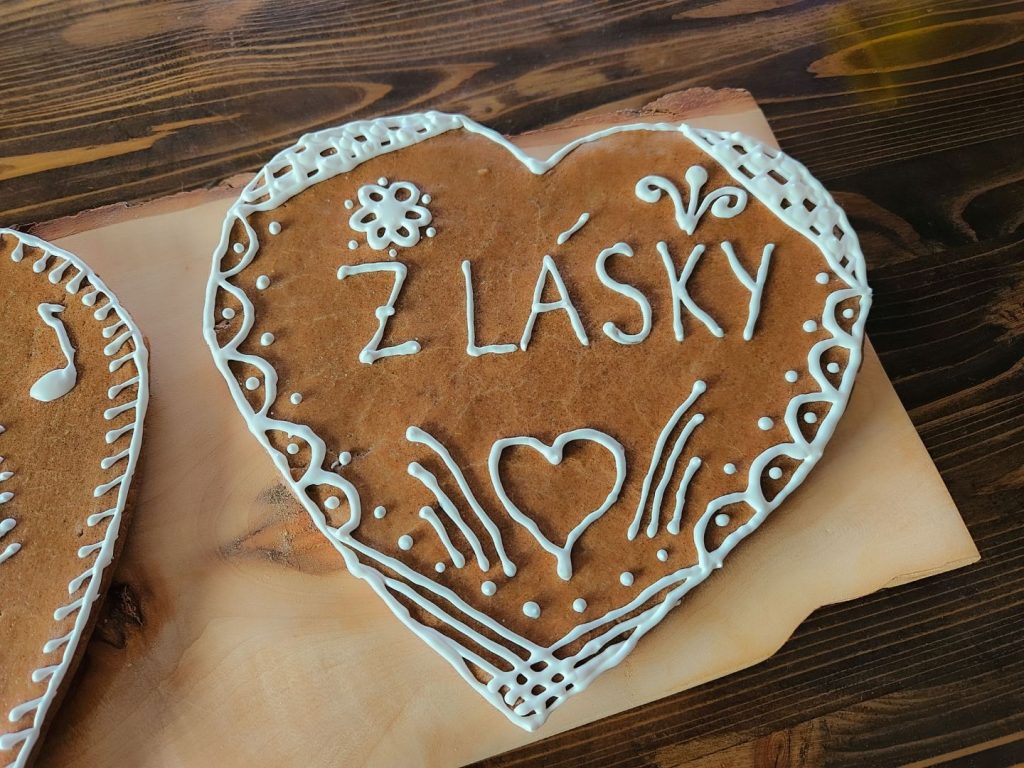 Close up shot on Gingerbread Heart Cookie saying from love.